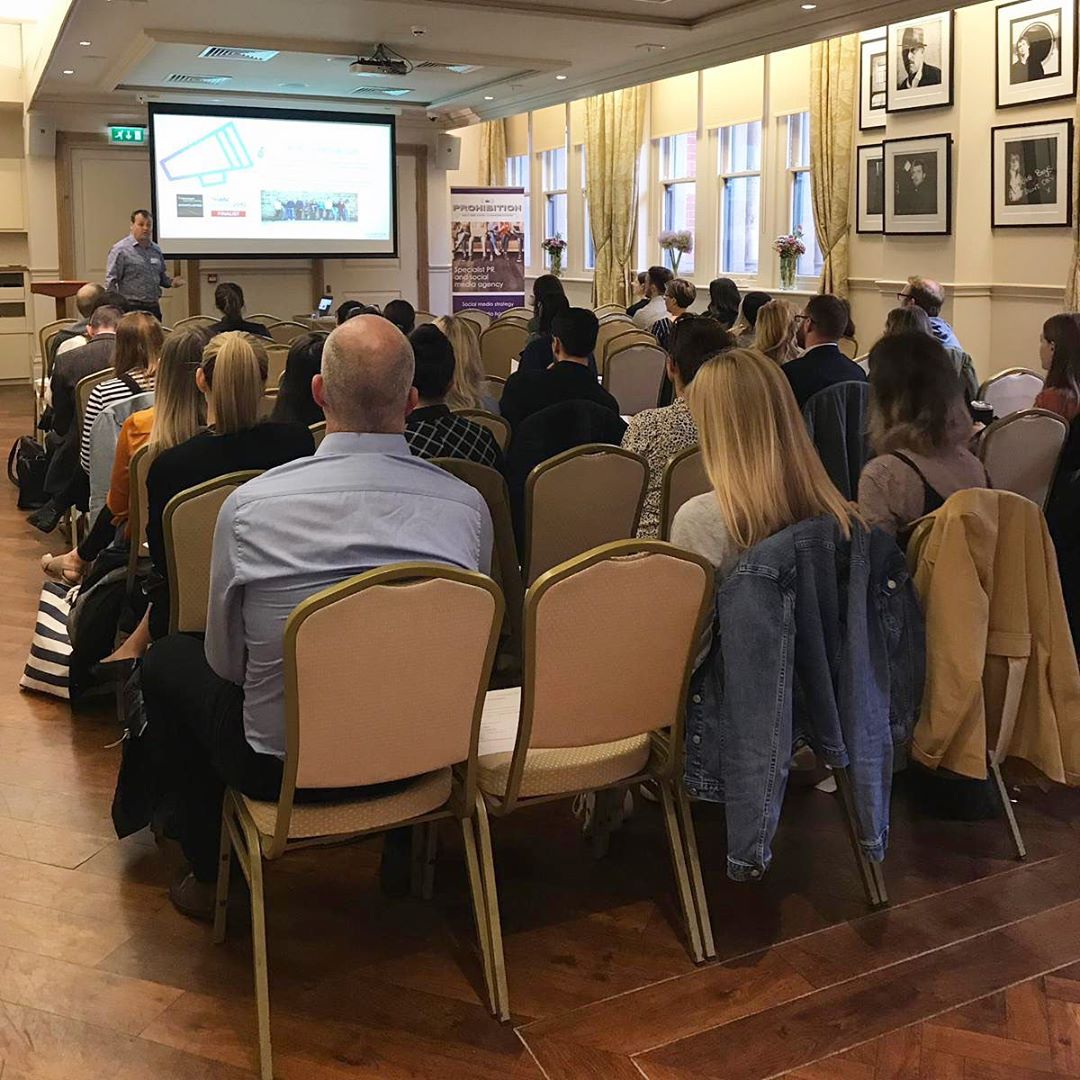 Chris Norton delivering AI training to a communications team